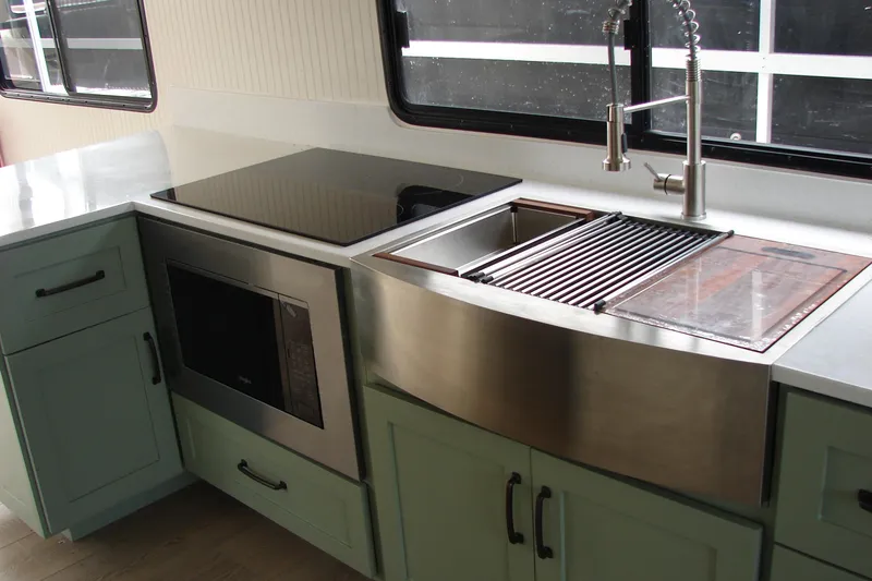 Slide: The Image of Modern kitchen in 1997 Gibson 47 Sport Houseboat with sleek appliances and stylish cabinetry. - 85