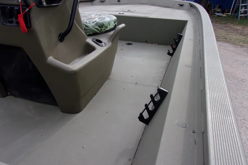 Slide: The Image of 2024 Tracker Grizzly 1860 CC boat interior with rod holders and seating. - 6