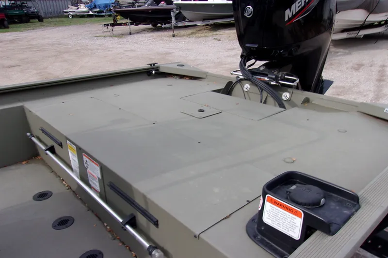 Slide: The Image of 2024 Tracker Grizzly 1860 CC boat with Mercury outboard motor, rear deck view. - 8