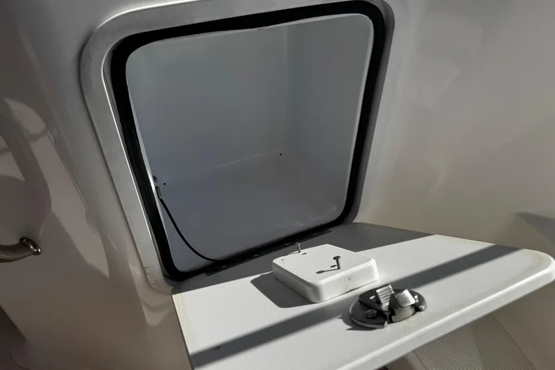 Slide: The Image of Open storage compartment on 2021 Hurricane SunDeck 2200 DC OB boat. - 19