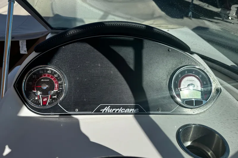 Slide: The Image of Dashboard of 2021 Hurricane SunDeck 2200 DC OB boat with gauges and logo. - 24