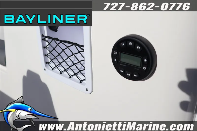 Slide: The Image of 2025 Bayliner Element E18 boat control panel with netted storage compartment. - 21
