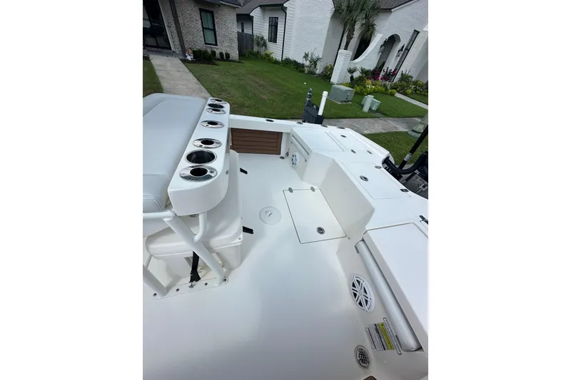 Slide: The Image of 2021 Pathfinder 2500 Hybrid boat deck with seating and storage compartments. - 12