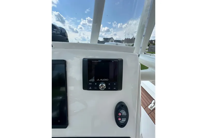 Slide: The Image of Control panel of 2021 Pathfinder 2500 Hybrid boat with JL Audio system. - 17