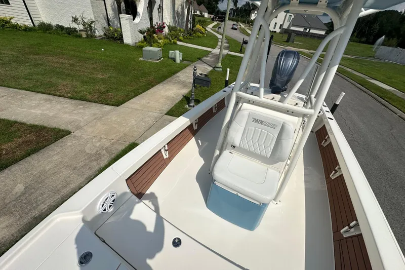 Slide: The Image of 2021 Pathfinder 2500 Hybrid boat parked in a residential neighborhood. - 20