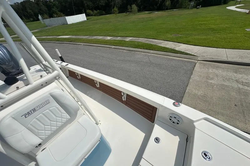 Slide: The Image of 2021 Pathfinder 2500 Hybrid boat on a road, showcasing interior seating and design. - 21