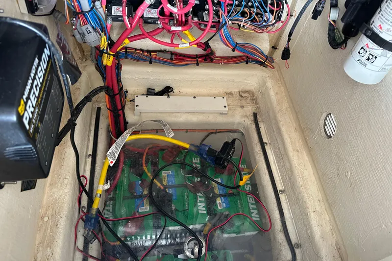 Slide: The Image of Electrical wiring and battery setup in a 2021 Pathfinder 2500 Hybrid boat. - 24