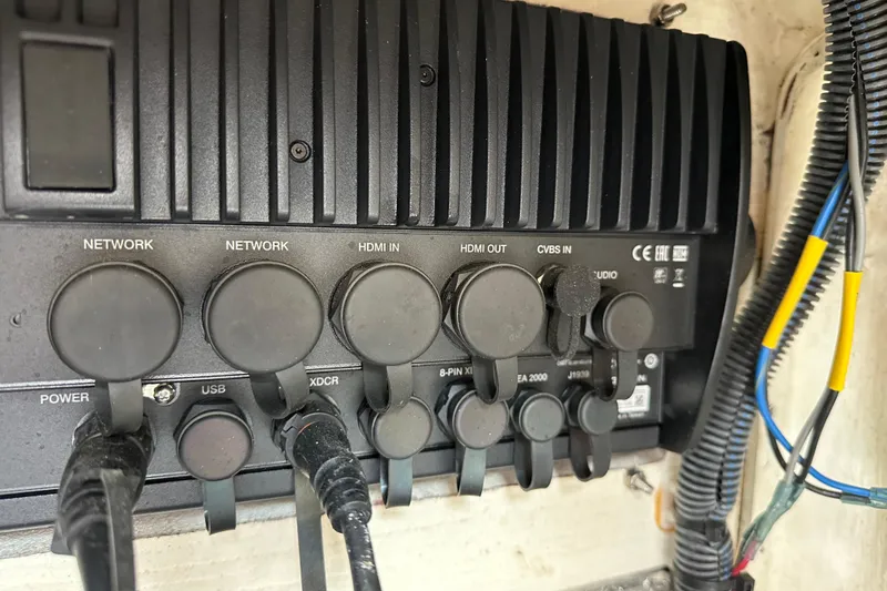 Slide: The Image of Control panel with various ports and cables on a 2021 Pathfinder 2500 Hybrid. - 25