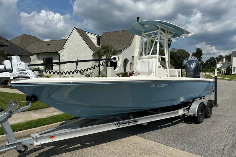 Slide: The Image of 2021 Pathfinder 2500 Hybrid boat on trailer in suburban neighborhood. - 6