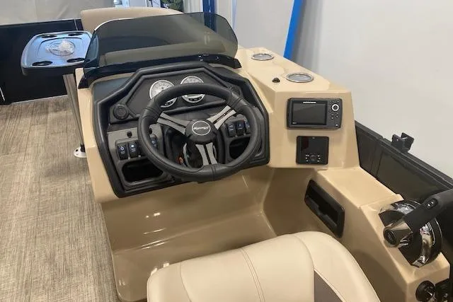 Slide: The Image of 2026 Bentley Pontoons Legacy 223 Navigator dashboard with steering wheel and controls. - 8