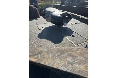 Slide: The Image of 2026 G3 Sportsman 1710 PFX boat deck with motor, featuring camo pattern. - 1