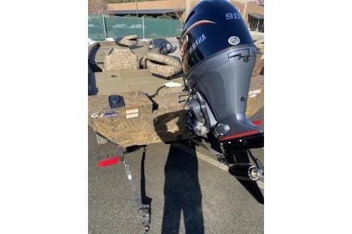 Slide: The Image of 2026 G3 Sportsman 1710 PFX boat with Yamaha outboard motor, parked outdoors. - 7
