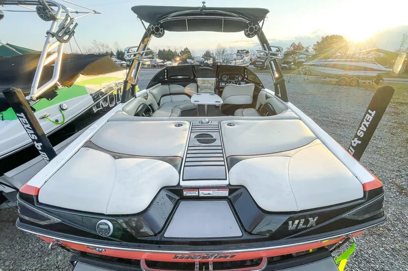 Slide: The Image of 2011 Malibu Wakesetter 21 VLX boat with spacious seating and sleek design. - 10