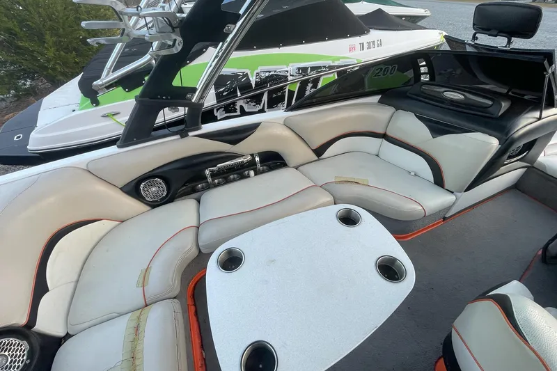 Slide: The Image of Interior of a 2011 Malibu Wakesetter 21 VLX boat with seating and table. - 17