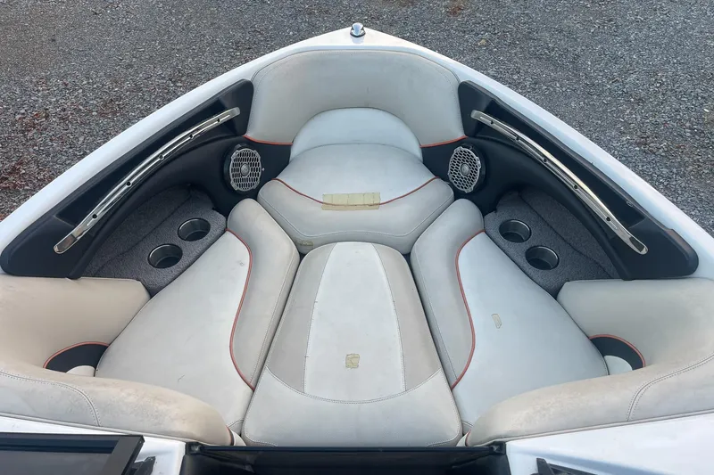 Slide: The Image of Interior of 2011 Malibu Wakesetter 21 VLX boat with cushioned seating and cup holders. - 20