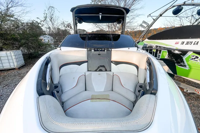 Slide: The Image of 2011 Malibu Wakesetter 21 VLX boat interior with seating and cup holders. - 21