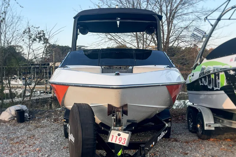 Slide: The Image of 2011 Malibu Wakesetter 21 VLX boat on trailer, parked outdoors. - 4