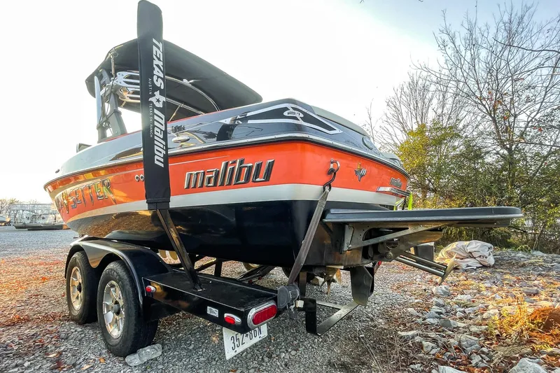 Slide: The Image of 2011 Malibu Wakesetter 21 VLX boat on trailer, parked outdoors. - 9