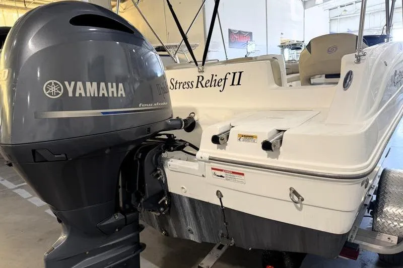Slide: The Image of 2019 Hurricane SunDeck Sport 188 OB boat with Yamaha outboard motor in a showroom. - 12