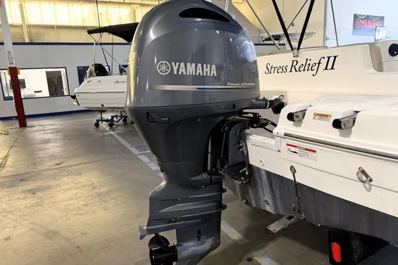 Slide: The Image of 2019 Hurricane SunDeck Sport 188 OB with Yamaha outboard motor in a showroom. - 13