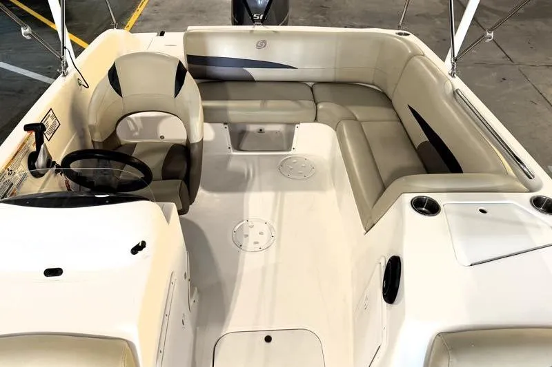 Slide: The Image of 2019 Hurricane SunDeck Sport 188 OB boat interior with seating and steering wheel. - 20