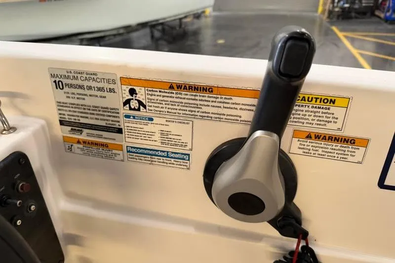 Slide: The Image of Control panel of a 2019 Hurricane SunDeck Sport 188 OB with safety warnings. - 23