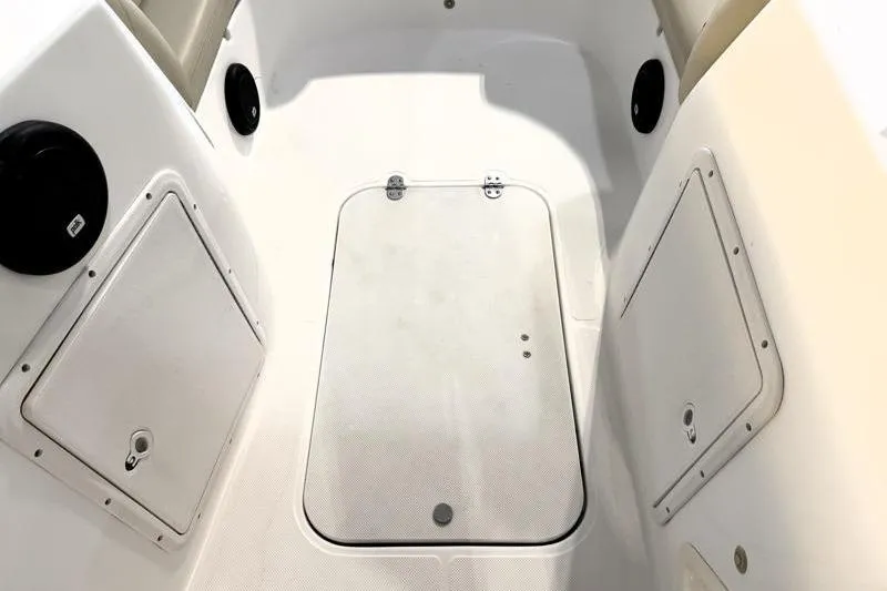 Slide: The Image of 2019 Hurricane SunDeck Sport 188 OB boat interior with storage compartments. - 24