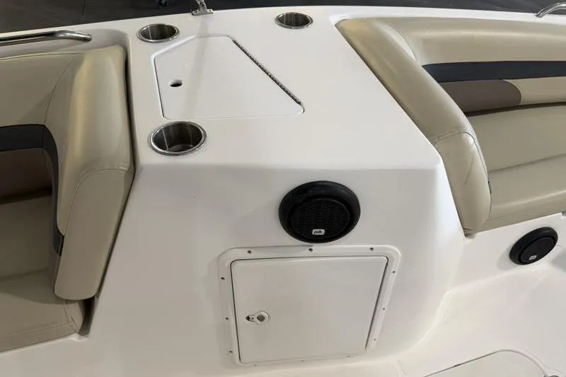 Slide: The Image of 2019 Hurricane SunDeck Sport 188 OB boat interior with cup holders and speaker. - 25