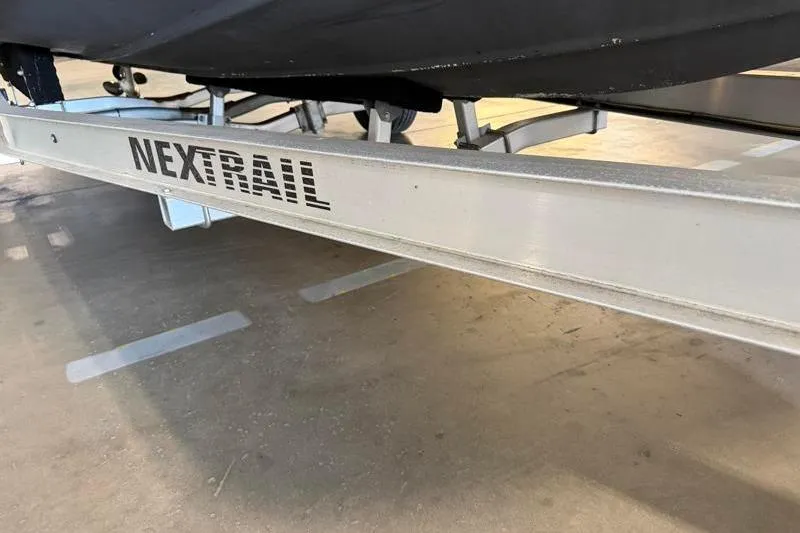 Slide: The Image of Trailer for 2019 Hurricane SunDeck Sport 188 OB boat, featuring NexTrail branding. - 29