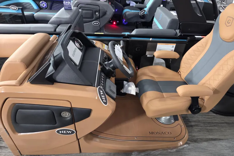 Slide: The Image of Captain's seat of 2026 Godfrey Monaco 255 MTF boat with modern dashboard. - 4