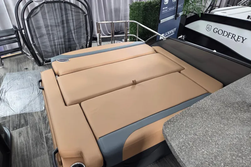 Slide: The Image of Luxurious seating on 2026 Godfrey Monaco 255 MTF boat, featuring tan upholstery. - 6