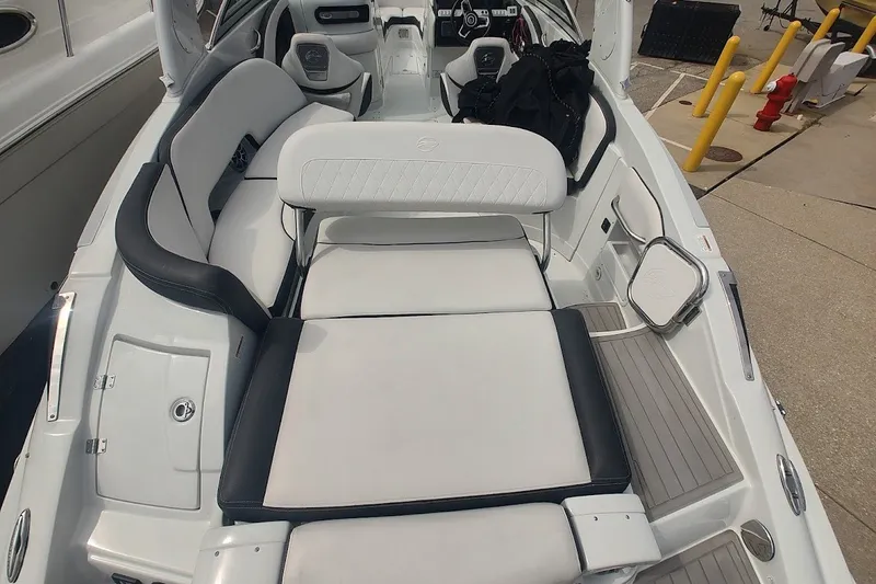 Slide: The Image of 2022 Crownline 280 SS boat interior with white seating and modern design. - 25