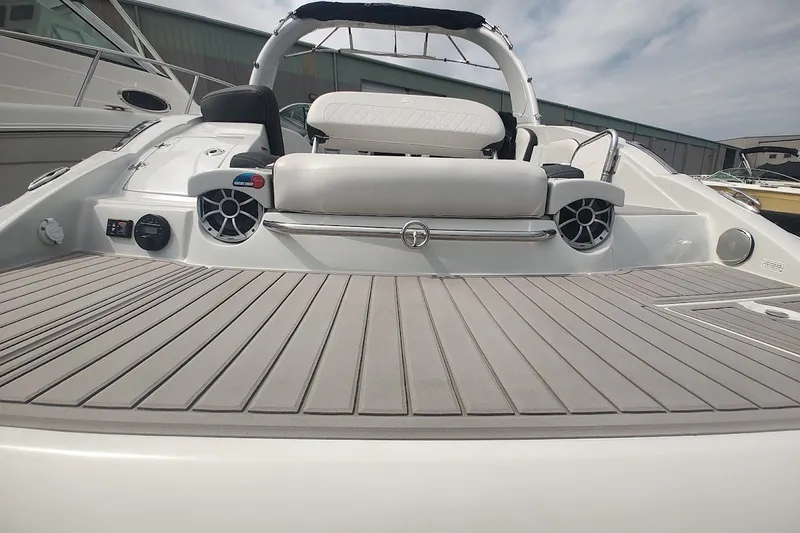 Slide: The Image of 2022 Crownline 280 SS boat with spacious deck and modern seating. - 27