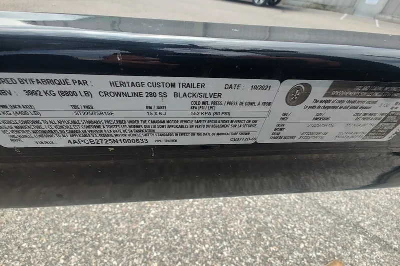 Slide: The Image of Label on 2022 Crownline 280 SS boat trailer, detailing specifications and compliance information. - 29