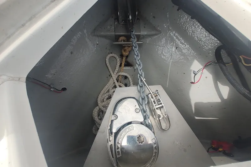 Slide: The Image of Anchor compartment of 2022 Crownline 280 SS boat with chain and rope. - 20