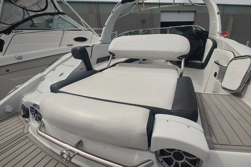 Slide: The Image of 2022 Crownline 280 SS boat with luxurious seating and sleek design. - 26