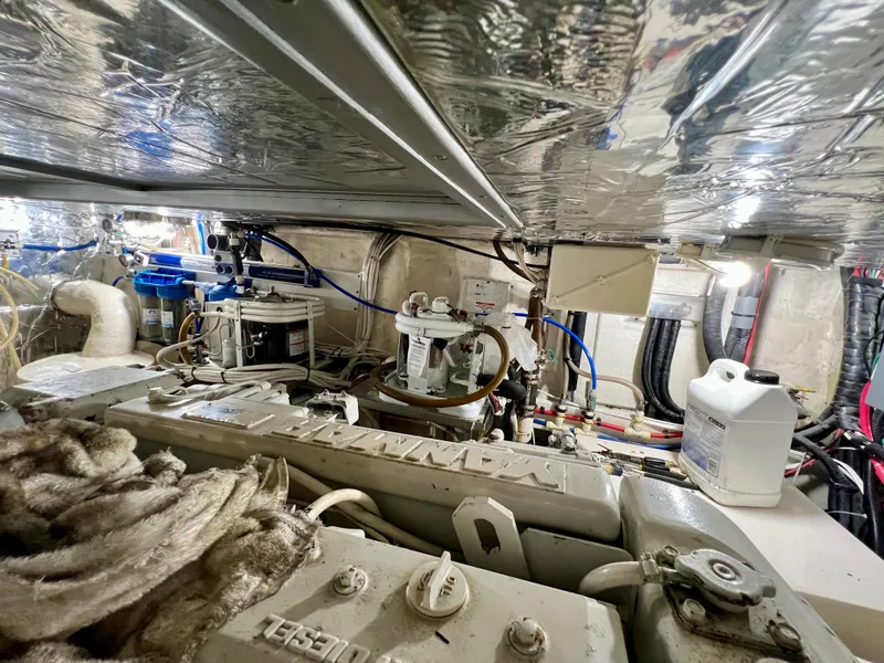 Slide: The Image of Engine room of 2004 Ocean Alexander Atlus 48 yacht, showcasing mechanical components and equipment. - 35