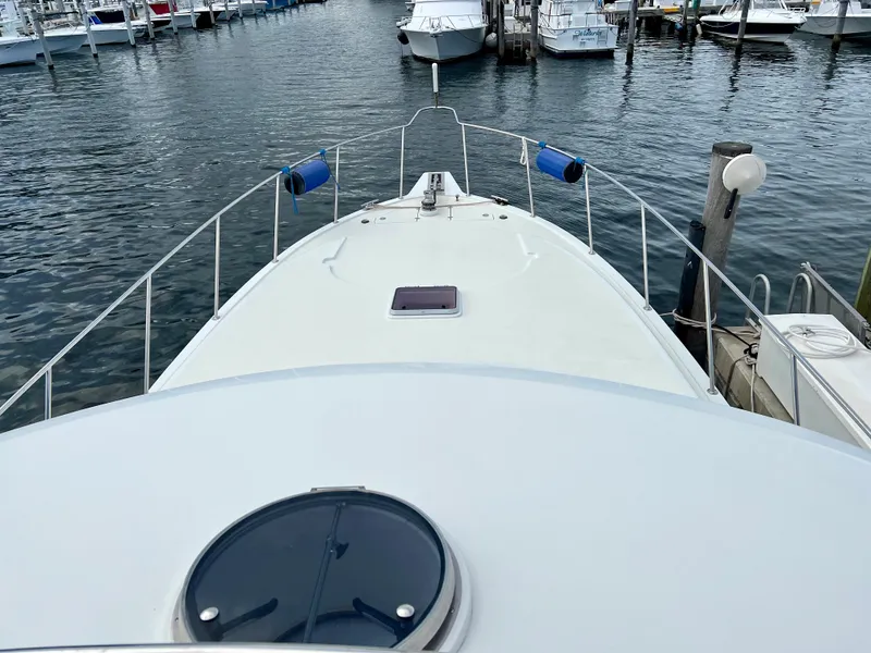 Slide: The Image of 2004 Ocean Alexander Atlus 48 yacht docked at marina, view from bow. - 7