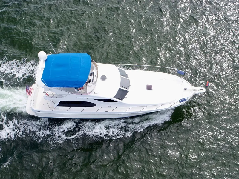 Slide: The Image of Aerial view of 2004 Ocean Alexander Atlus 48 yacht cruising on the water. - 9