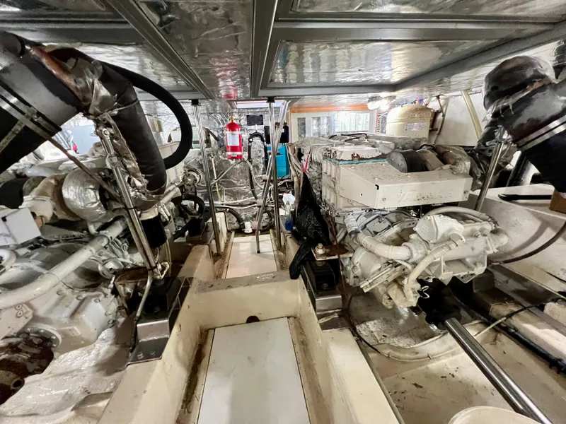 Slide: The Image of Engine room of 2004 Ocean Alexander Atlus 48 yacht, showcasing dual engines and equipment. - 33