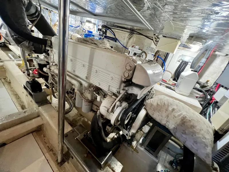 Slide: The Image of Engine room of 2004 Ocean Alexander Atlus 48 yacht, showcasing detailed machinery and components. - 34
