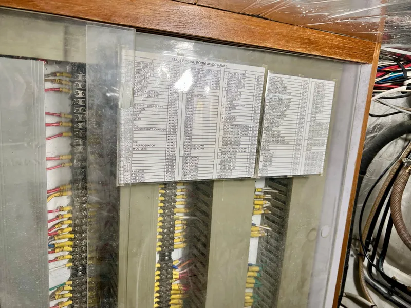 Slide: The Image of Electrical panel with wiring and labels on a 2004 Ocean Alexander Atlus 48 yacht. - 41