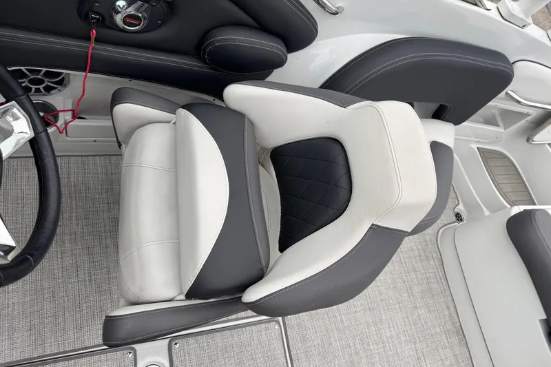Slide: The Image of 2022 Crownline 255 SS boat interior with luxurious seating and modern design. - 14