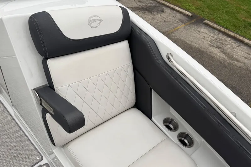 Slide: The Image of 2022 Crownline 255 SS boat seat with diamond stitching and armrest detail. - 16