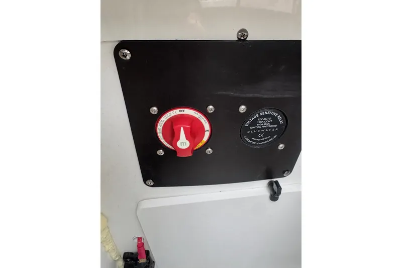 Slide: The Image of Control panel of 2022 Crownline 255 SS boat with voltage sensitive relay. - 21