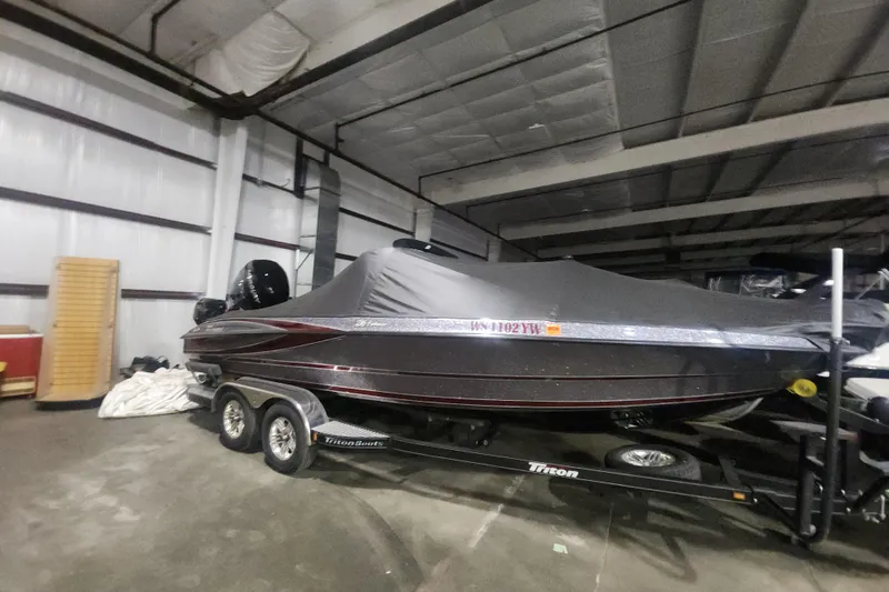 Slide: The Image of 2017 Triton 216 Fishunter boat with cover in indoor storage. - 15