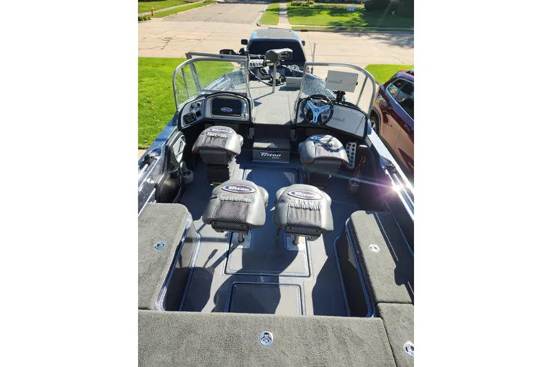 Slide: The Image of 2017 Triton 216 Fishunter boat interior with seating and steering console. - 4