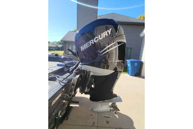 Slide: The Image of 2017 Triton 216 Fishunter with Mercury Verado outboard motor in driveway. - 9