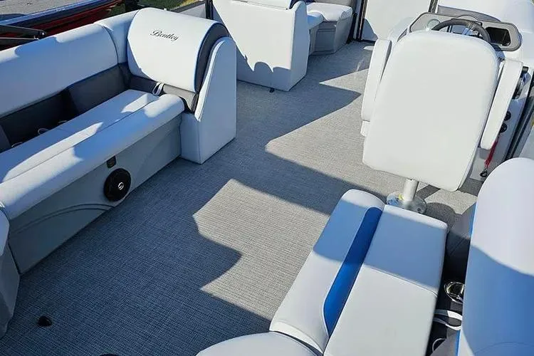 Slide: The Image of 2026 Bentley Pontoons Bolt 223 interior with modern seating and steering area. - 19