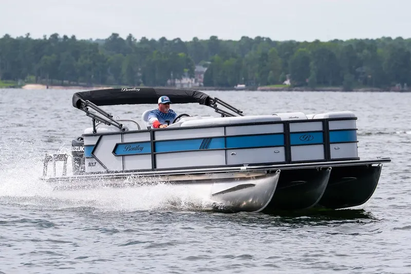 Slide: The Image of 2026 Bentley Pontoons Bolt 223 interior in a garage setting. - 2